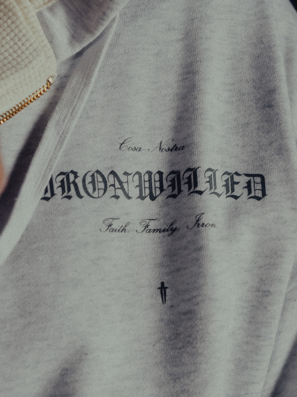 Detail of the Ironwilled Faith Family Iron chest graphic on heather grey