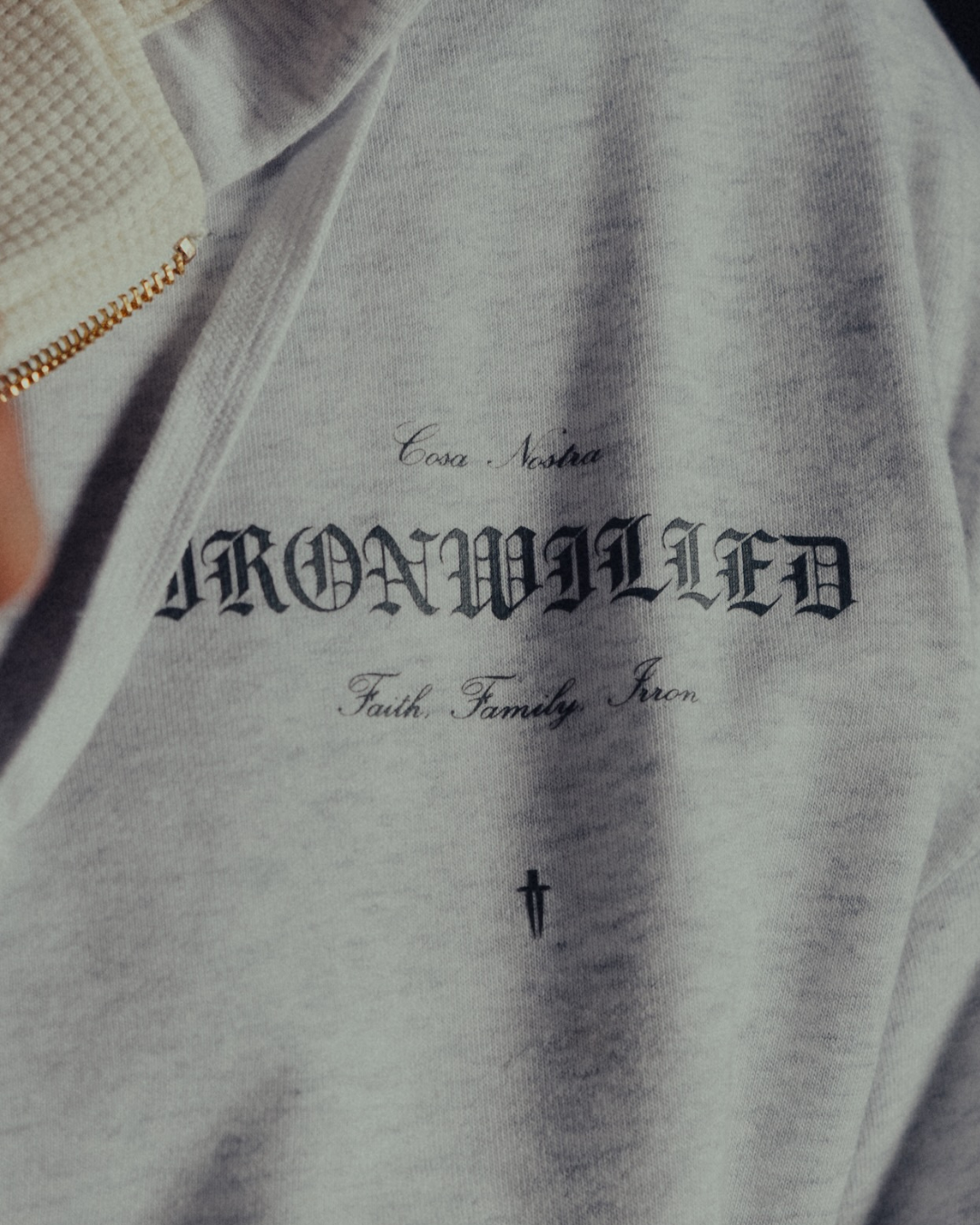 Detail of the Ironwilled Faith Family Iron chest graphic on heather grey