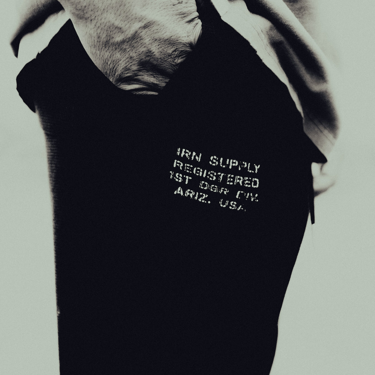 Close-up of the IRN SUPPLY print on the black waffle sweatpant