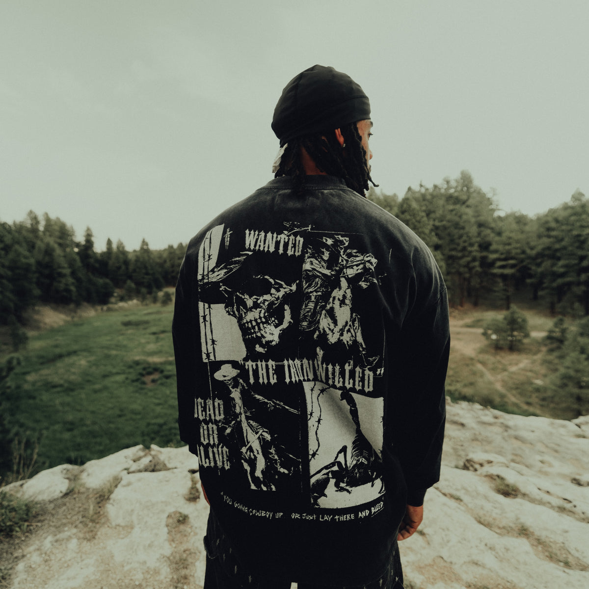 Back view of the Dead or Alive long sleeve on a rocky trail