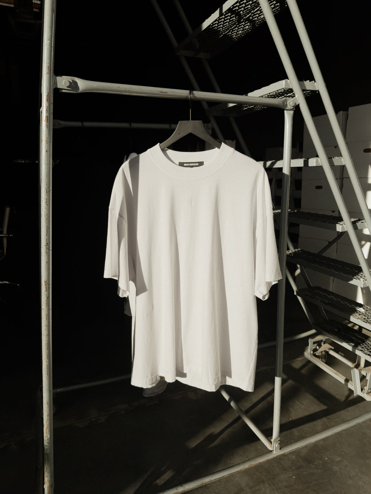 White classic crew tee on a hanger