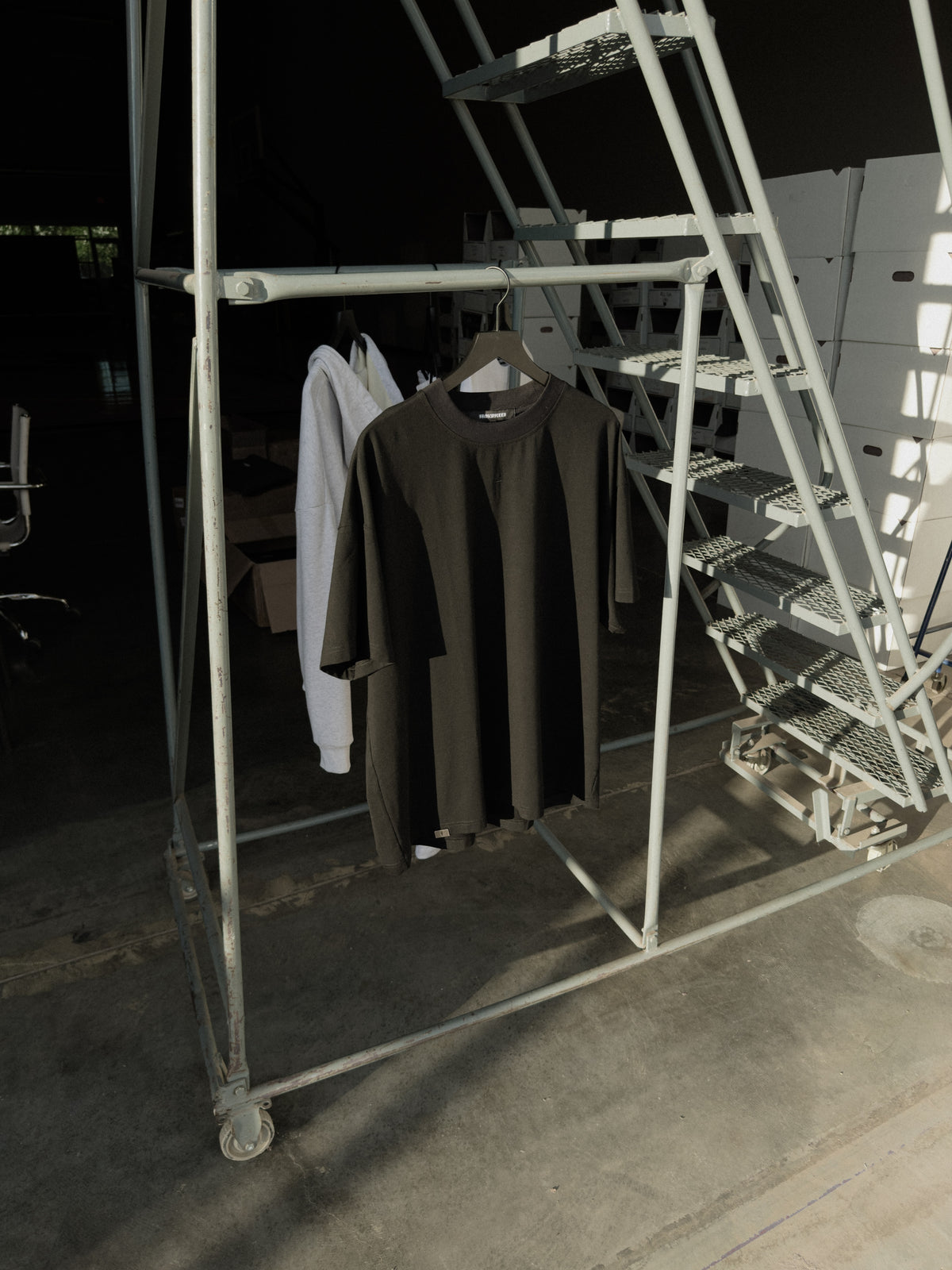 Black classic crew tee on a hanger