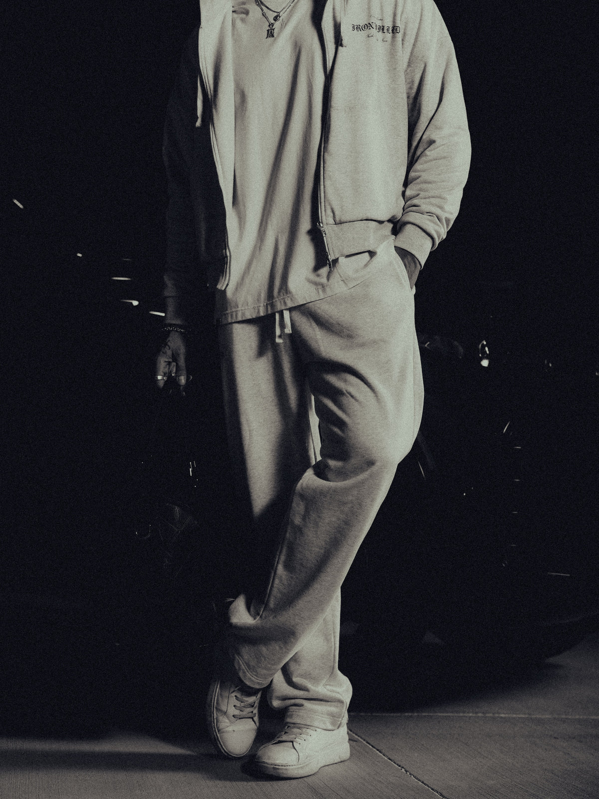 Model in the Heritage zip hoodie and matching relaxed sweatpants