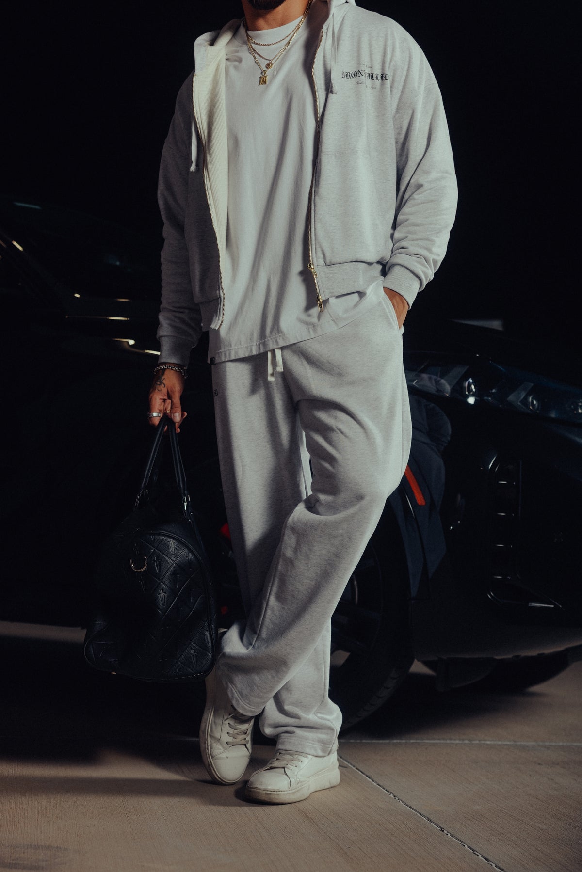 Model walking in the Heritage hoodie and relaxed sweatpants