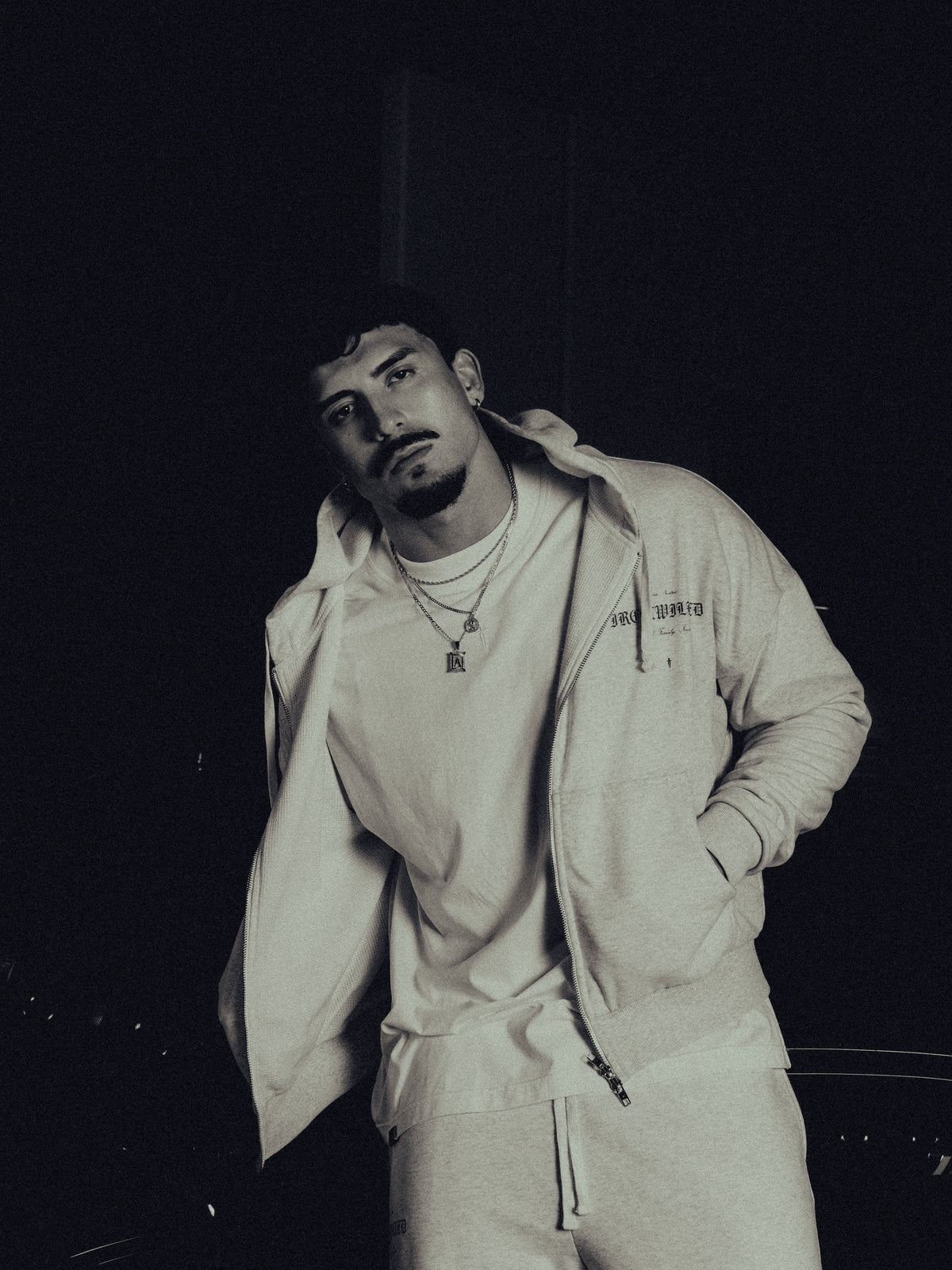 Model in the Heritage zip hoodie, hands in pockets