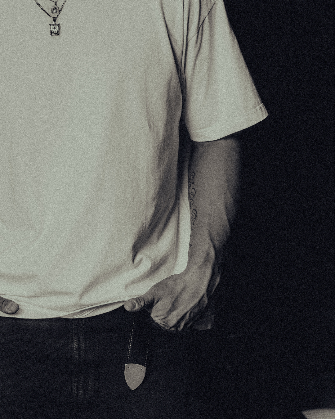 Sleeve and body of the white classic crew tee