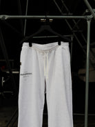 Heritage relaxed sweatpants on a hanger, drawcord waistband