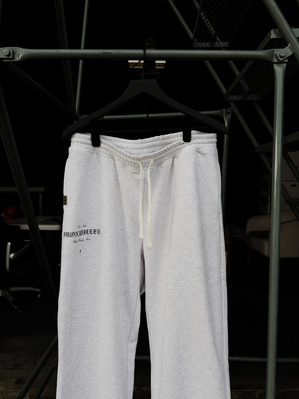 Heritage relaxed sweatpants on a hanger, drawcord waistband