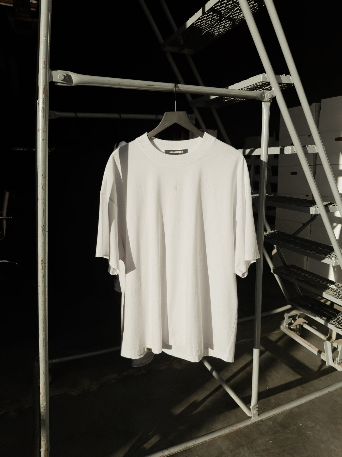 White classic crew tee on a hanger