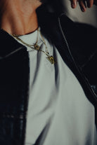 White classic crew tee under a black jacket