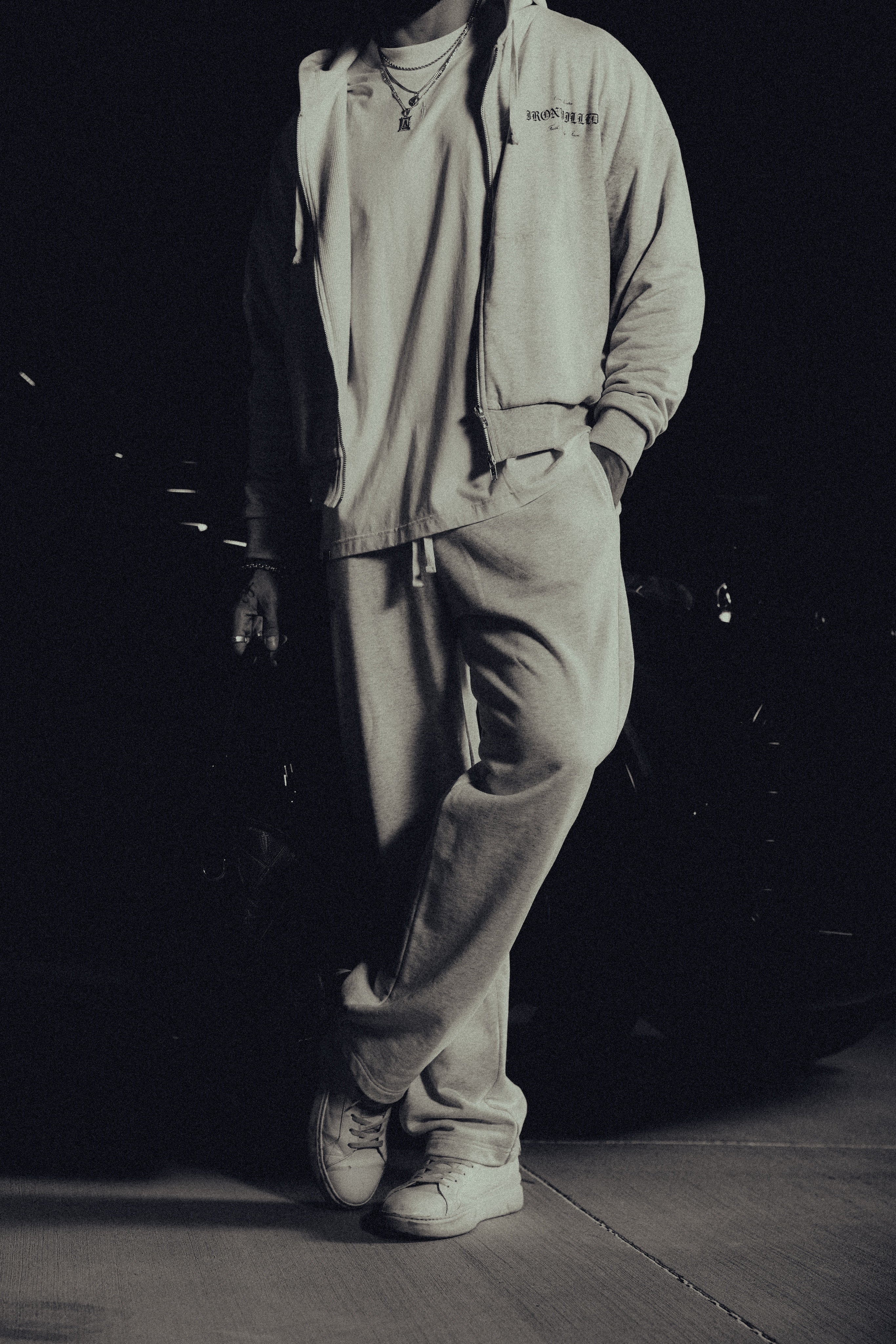 Model in the Heritage zip hoodie and matching relaxed sweatpants