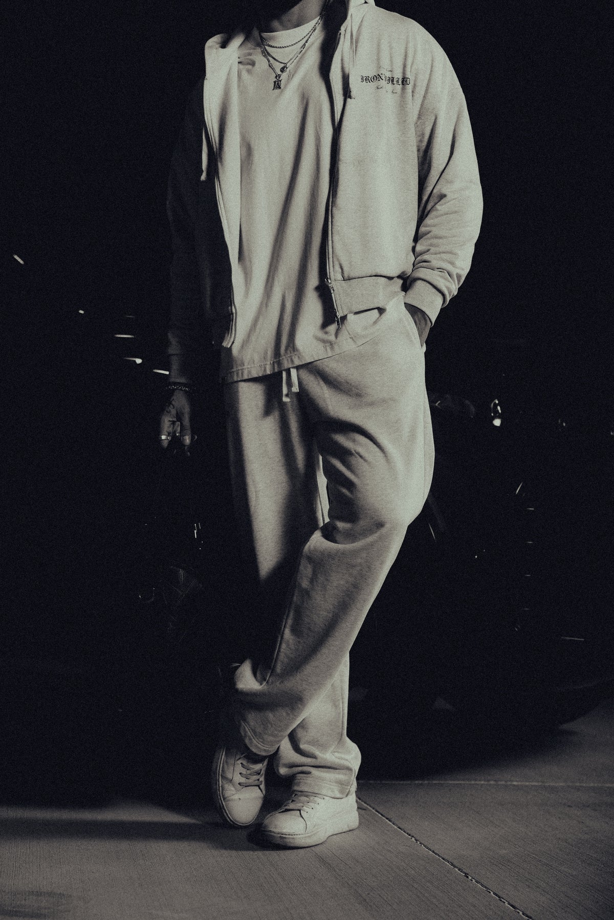 Model in the Heritage zip hoodie and matching relaxed sweatpants