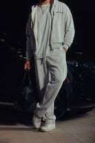 Model walking in the Heritage hoodie and relaxed sweatpants