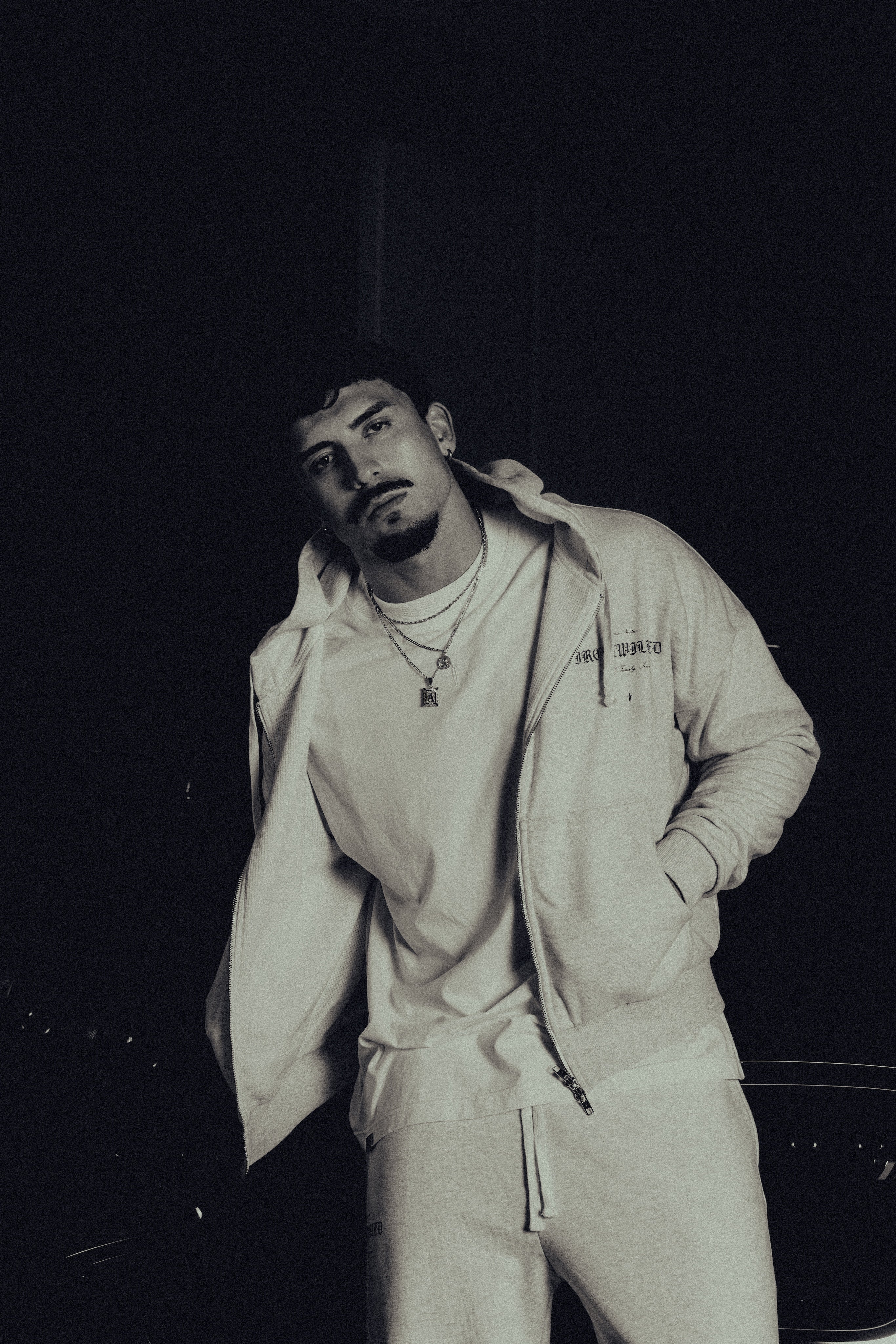 Model in the Heritage zip hoodie, hands in pockets