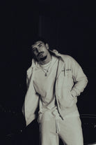 Model in the Heritage zip hoodie, hands in pockets
